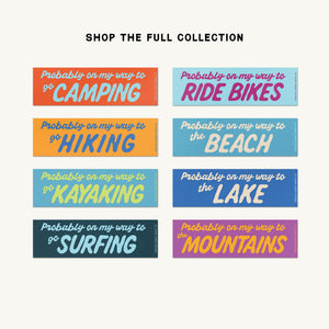 A grid of ten colorful rectangular sticker designs on a light beige background, with the text 'SHOP THE FULL COLLECTION' above them. Each sticker has a different activity phrase such as Camping, Hiking, Beach, Kayaking, Lake, Surfing, and Mountains in stylized lettering.