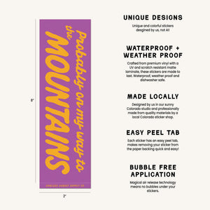 A product information graphic showing a purple rectangular bumper sticker with yellow text reading 'Probably on my way to the Mountains' on the left, alongside feature callouts such as 'UNIQUE DESIGNS,' 'WATERPROOF + WEATHER PROOF,' 'MADE LOCALLY,' 'EASY PEEL TAB,' and 'BUBBLE FREE APPLICATION.'.